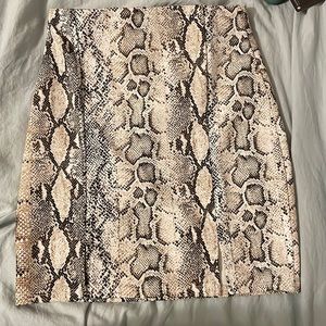 Tight snakeskin print mini skirt